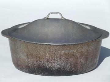 catalog photo of vintage hammered aluminum oval dutch oven roaster, big roasting pan