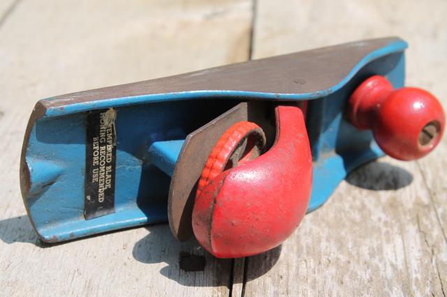 photo of vintage hand block plane, old woodworking tool shave wood planer w/ red & blue paint #6