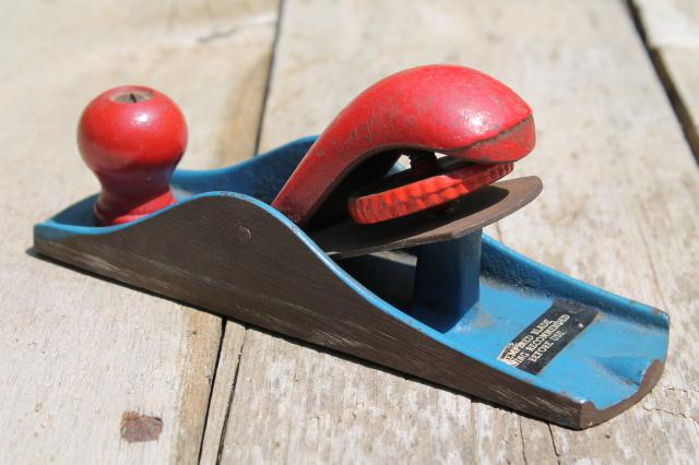 photo of vintage hand block plane, old woodworking tool shave wood planer w/ red & blue paint #7