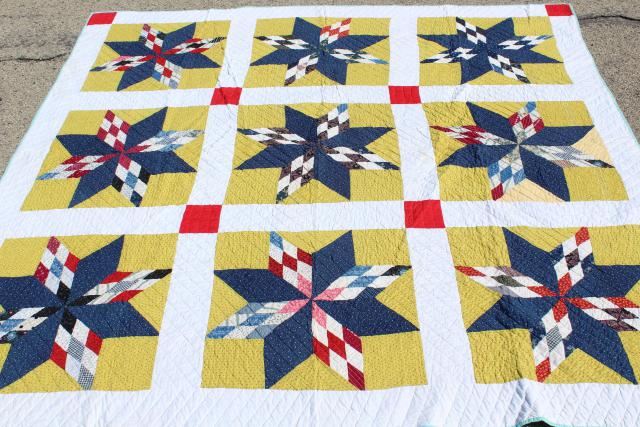 photo of vintage hand stitched cotton quilt, big lone star blocks red, blue, mustard yellow  #1