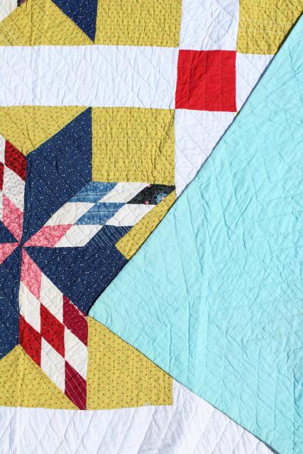 photo of vintage hand stitched cotton quilt, big lone star blocks red, blue, mustard yellow  #12