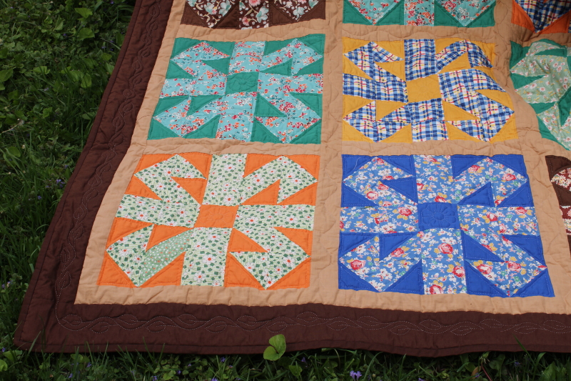 photo of vintage hand stitched handmade patchwork quilt, all cotton fabrics brown w/ mid century prints, retro colors  #9