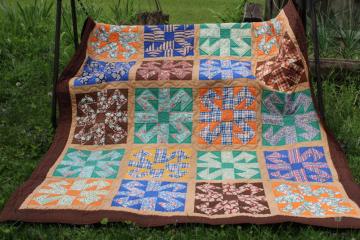 catalog photo of vintage hand stitched handmade patchwork quilt, all cotton fabrics brown w/ mid century prints, retro colors 