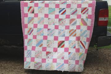 catalog photo of vintage hand stitched quilt, all cotton fabric soft & worn, pink & white w/ pretty prints