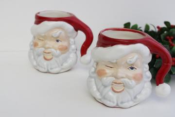 catalog photo of vintage handmade ceramic Santa mugs, winking Santas, retro Christmas decor