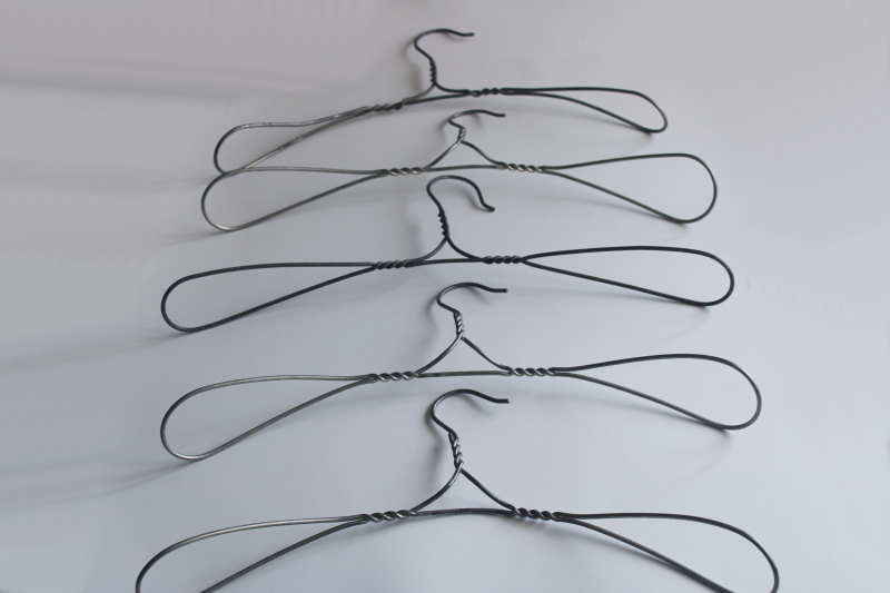 photo of vintage heavy wire clothes coat hangers, well made utilitarian industrial minimalist  #1