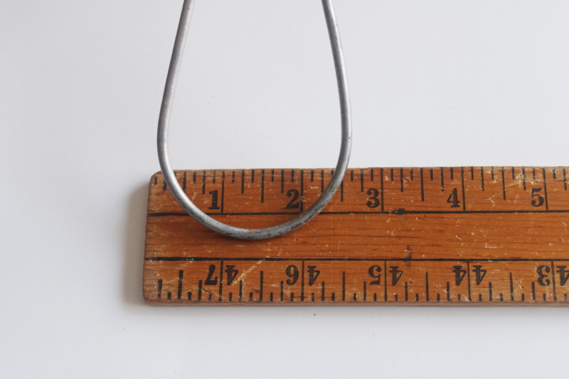 photo of vintage heavy wire clothes coat hangers, well made utilitarian industrial minimalist  #3