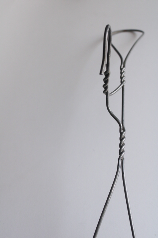 photo of vintage heavy wire clothes coat hangers, well made utilitarian industrial minimalist  #4