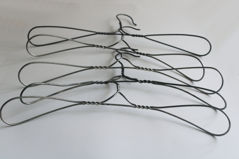 photo of vintage heavy wire clothes coat hangers, well made utilitarian industrial minimalist  #5