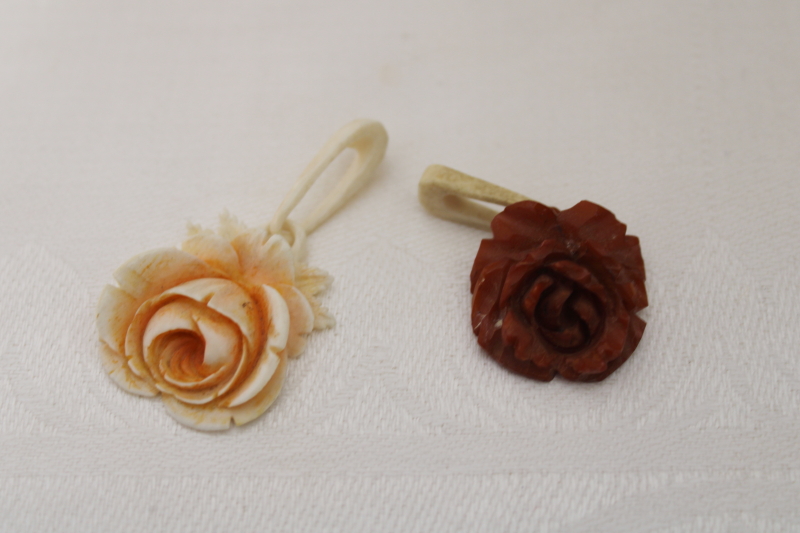 photo of vintage jewelry, carved bone rose pendants, one white, one brown #1