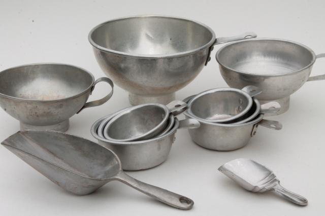 photo of vintage kitchenware lot, aluminum metal measuring cups, scoops, funnels #1