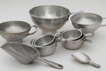 catalog photo of vintage kitchenware lot, aluminum metal measuring cups, scoops, funnels