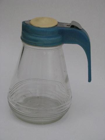 photo of vintage kitchenware lot, collection of kitchen glass syrup pitchers #3