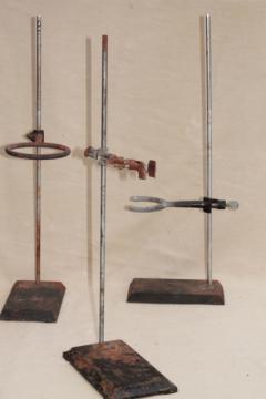 catalog photo of vintage lab beaker stands, heavy steel holder racks for laboratory glassware, bottles, flasks