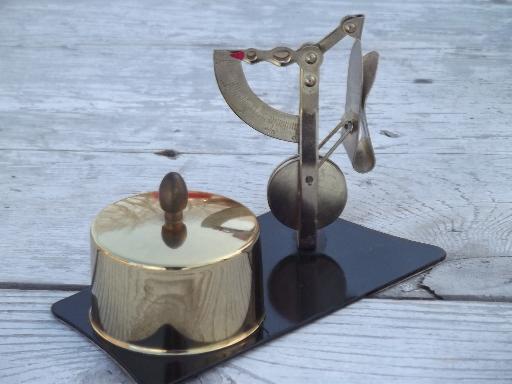 photo of vintage letter scale, brass balance scale holder for a roll of postage stamps #1