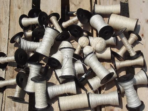 photo of vintage loom shuttle weaving bobbins, old black spools w/ heavy thread #1