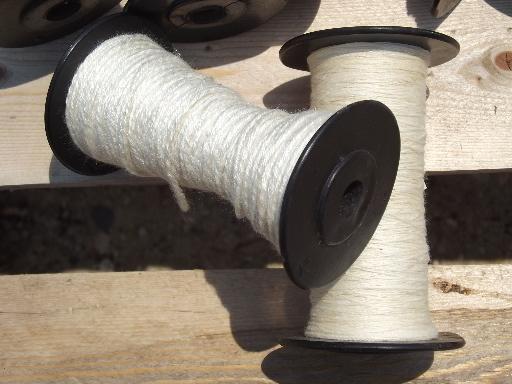 photo of vintage loom shuttle weaving bobbins, old black spools w/ heavy thread #2