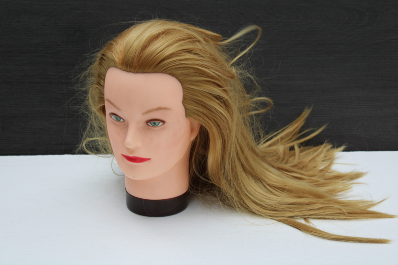 photo of vintage mannequin plastic head model life size with long hair, green eyed strawberry blonde redhead #1