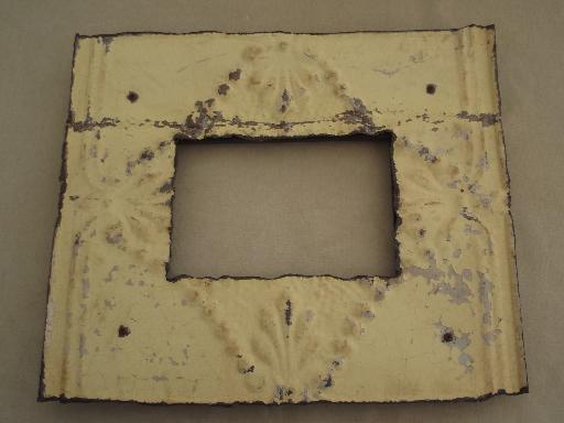 photo of vintage metal frame made of embossed tin ceiling with shabby old paint #1