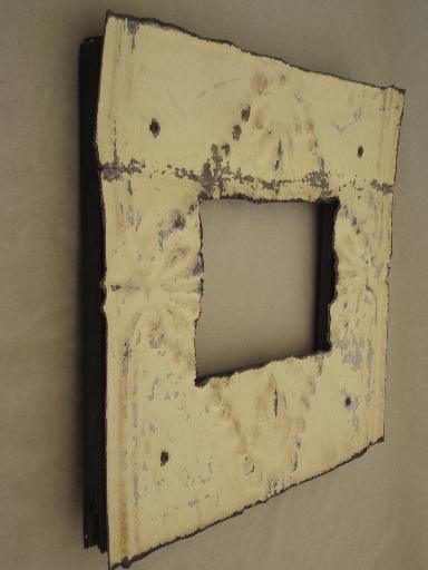 photo of vintage metal frame made of embossed tin ceiling with shabby old paint #2