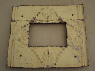 catalog photo of vintage metal frame made of embossed tin ceiling with shabby old paint