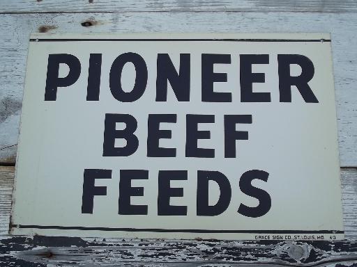 photo of vintage metal sign Pioneer Beef Feed, old  farm feed mill advertising #1