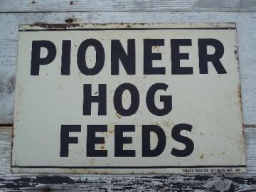 catalog photo of vintage metal sign Pioneer Hog Feed, old farm feed mill advertising