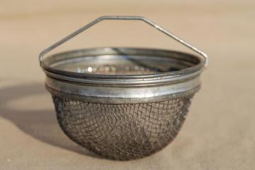 catalog photo of vintage metal tea strainer basket, wire mesh sieve for teapot or old coffee maker