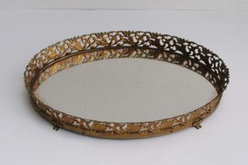 catalog photo of vintage mirrored glass vanity tray, footed plateau oval shape gold metal filigree frame 