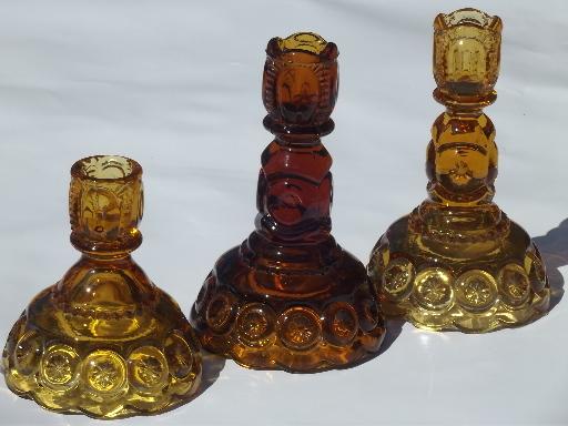 photo of vintage moon & stars pattern glass candlesticks, light & dark amber glass #1