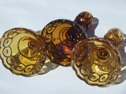 photo of vintage moon & stars pattern glass candlesticks, light & dark amber glass #2