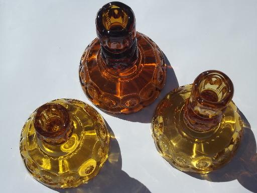 photo of vintage moon & stars pattern glass candlesticks, light & dark amber glass #3