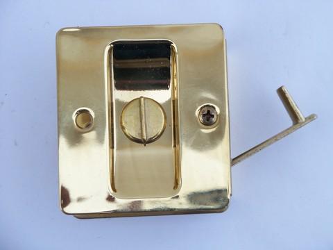 photo of vintage new-old-stock mid-century architectural hardware, brass door lock for sliding pocket door #2