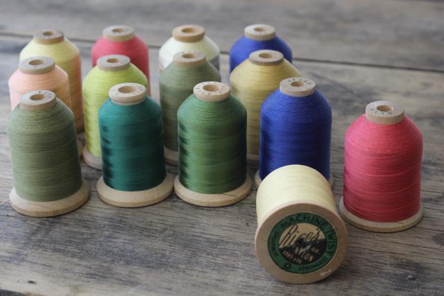 photo of vintage nylon sewing thread in jewel colors on big old wooden spools #3