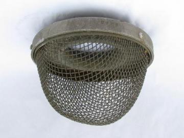 catalog photo of vintage old protective wire cage, industrial lighting