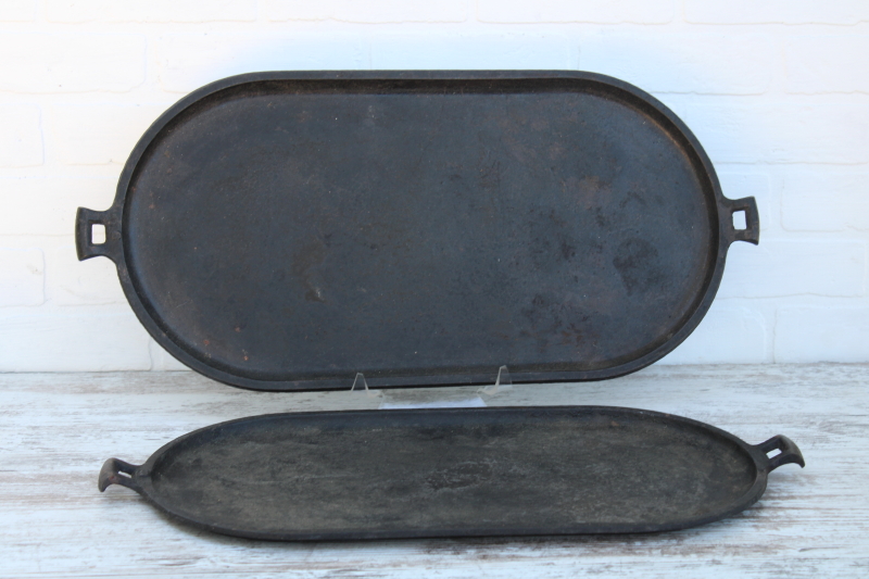 photo of vintage or antique cast iron griddles number 8-9, long oval pans gate mark bottoms #1