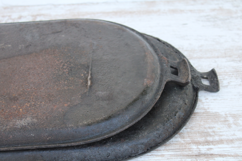 photo of vintage or antique cast iron griddles number 8-9, long oval pans gate mark bottoms #4