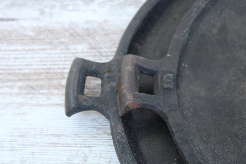 photo of vintage or antique cast iron griddles number 8-9, long oval pans gate mark bottoms #6