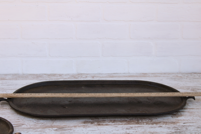 photo of vintage or antique cast iron griddles number 8-9, long oval pans gate mark bottoms #13