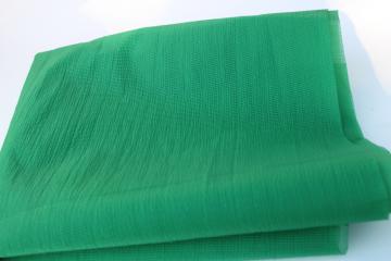 photo of vintage organza fabric, sheer nylon crinkle plisse texture, kelly green solid color