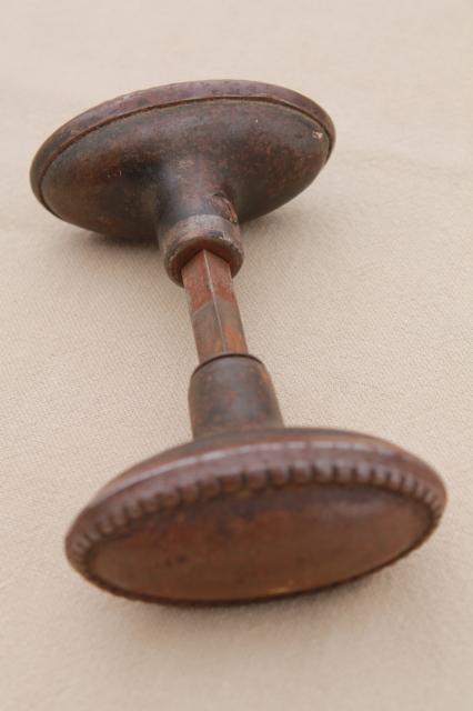 photo of vintage oval door knobs  beaded edge back plates,   antique tiger stripe japanned copper finish #2