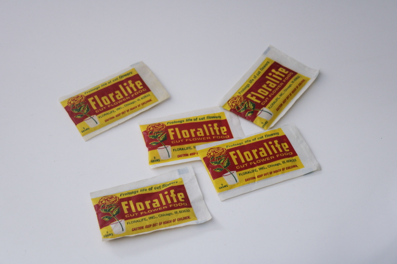 photo of vintage packaging, sealed packets of florist flowers preserver, Floralife red rose graphics #1