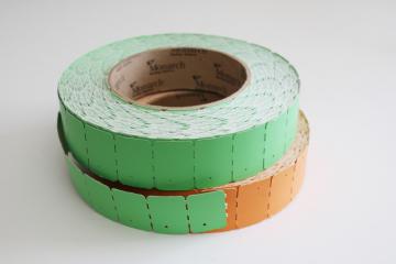 catalog photo of vintage paper ephemera, orange & green plain paper ticket rolls, holiday or party decor