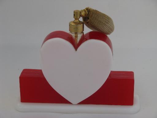 photo of vintage perfume spray atomizer, red and white plastic heart vanity bottle #1