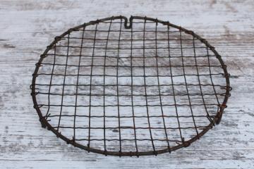catalog photo of vintage pie or cake cooling rack, little round stand wavy crimped wire w/ feet, baking photo prop 