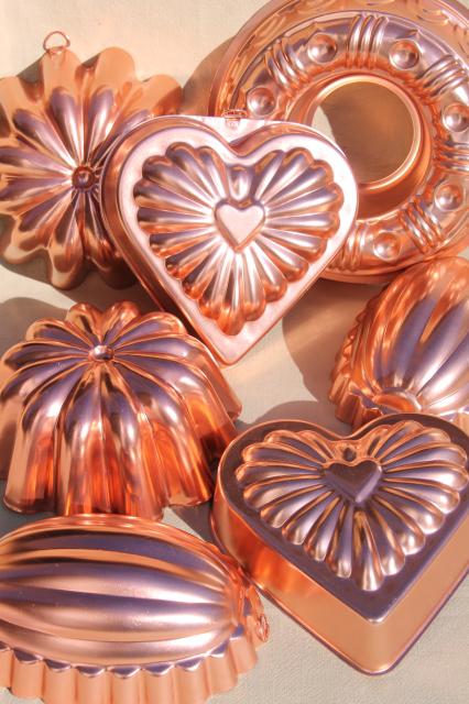 photo of vintage pink aluminum copper jello molds, decorative wall hangers kitchen food mold collection #1