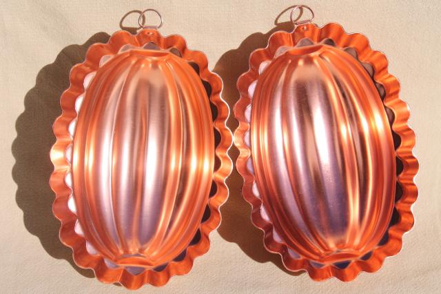 photo of vintage pink aluminum copper jello molds, decorative wall hangers kitchen food mold collection #2