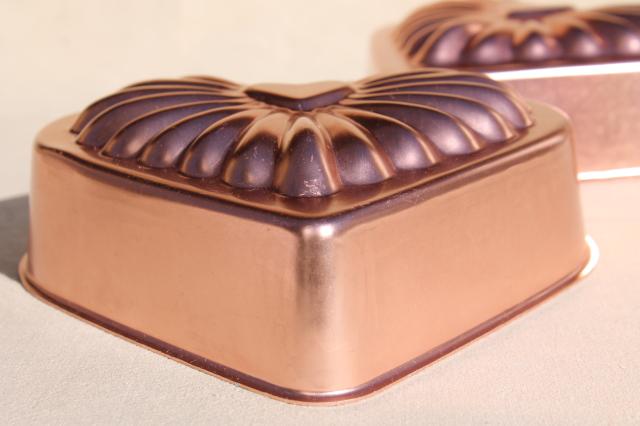 photo of vintage pink aluminum copper jello molds, decorative wall hangers kitchen food mold collection #4