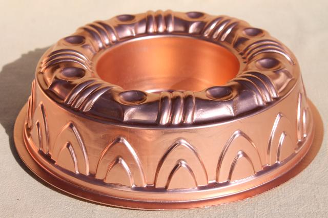 photo of vintage pink aluminum copper jello molds, decorative wall hangers kitchen food mold collection #7