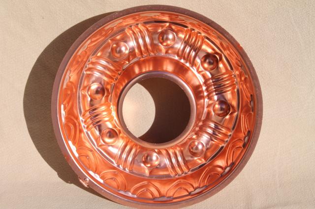 photo of vintage pink aluminum copper jello molds, decorative wall hangers kitchen food mold collection #8